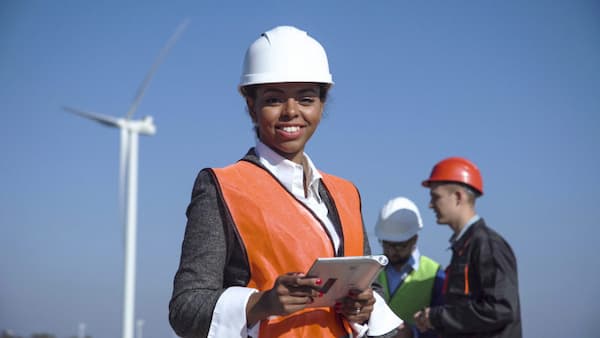 female engineer in orange vest